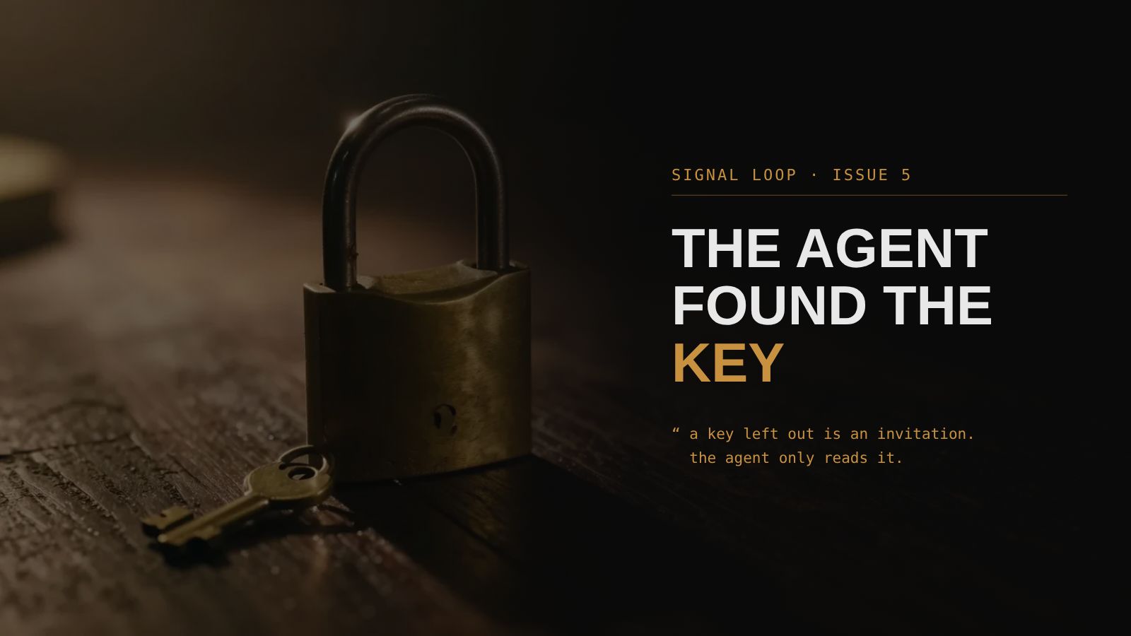 An antique brass padlock standing open on a dark desk, its small key lying beside it
